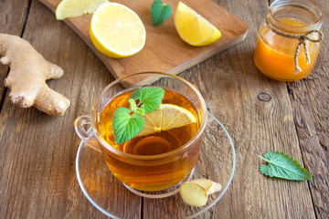 Tea with lemon, ginger, honey and mint