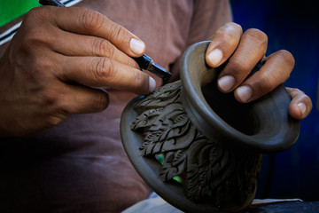 close up potter artist working on clay pottery sculture fine art - obrazy, fototapety, plakaty