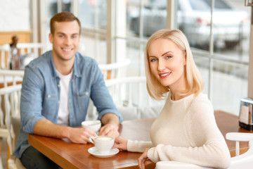 Fototapeta premium Loving couple sitting in the cafe 