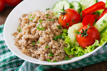 Porridge with fresh vegetables and lettuce. Healthy breakfast. Proper nutrition. Dietary menu.