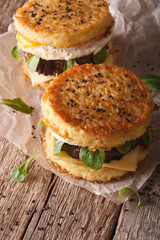 Two ramen burger close-up on a table. vertical

