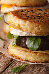Juicy ramen burger with egg macro on the table. Vertical
