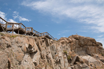 Wood bridge on granite rock