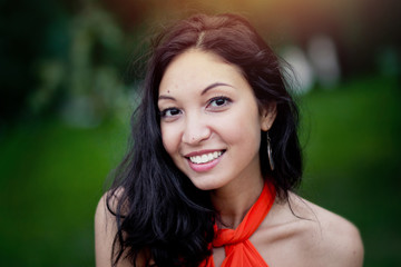 Smiling brunette in park