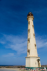 Red and White Barrcades Around Lighthouse