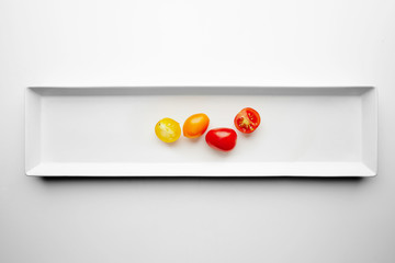 Yellow and red cherry tomatoes isolated