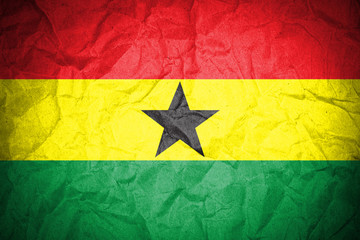 Ghana flag on crumpled paper