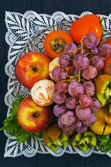 Fruits on a plate on a blue background