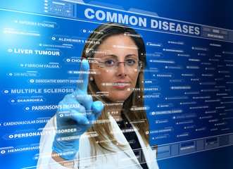 woman doctor using a virtual touch screen interface with a list Common diseases /female doctor touching the interface of a virtual application where a list of species common diseases 