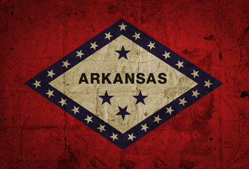 Grunge flag of Arkansas on old paper 