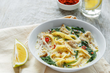 Coconut Curry Chicken Soup with noodles in a plate