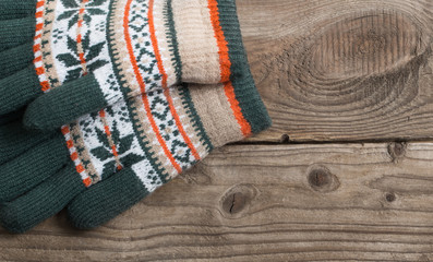 winter gloves on wooden background