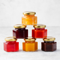 Glass jars with homemade jam Preserved fruits 