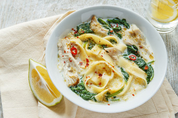 Coconut Curry Chicken Soup with noodles in a plate