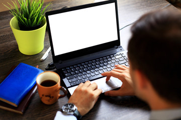 Male hands typing on laptop keyboard