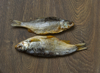 dried fish on wooden background.