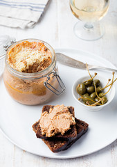 Baked meat pate in jar and on bread Gourmet food