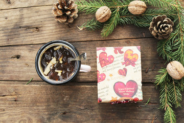 Vintage mug of hot chocolate and Christmas decortion