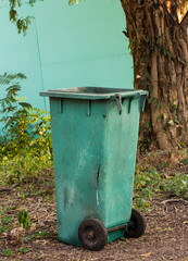 green trashcan in the park