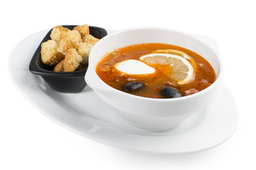 Meat soup with salami, ham chicken and beef fillet, with the addition of olives and lemon