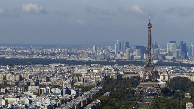 Aerial view, from Montparnasse tower, with Eiffel tower and La Defense district in Paris, France.