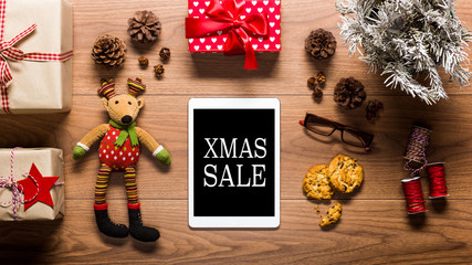 Desk view from above with digital tablet and presents, online shopping Xmas sale concept