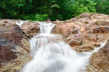 Manora Small Waterfall and rock in tropical forest,Phattalung Province (Un-focus image)