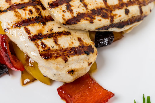 Grilled chicken breast with paprika.