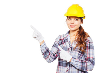 Young woman in construction helmet and check shirt