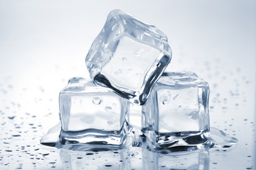 Three melting ice cubes