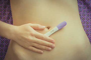 Positive pregnancy test on belly