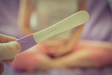 Pregnant woman and pregnancy test