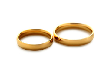 Golden wedding rings isolated on a white