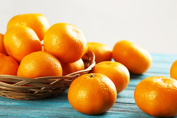 Ripe mandarins on a blue wooden table