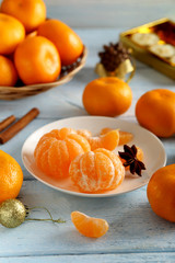 Ripe mandarins on a blue wooden table