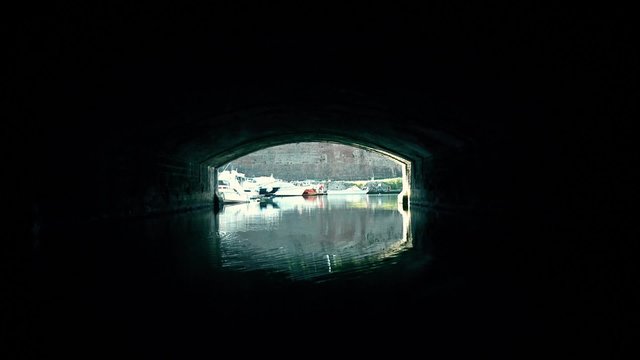 A terrifying trip in a black tunnel on the water
