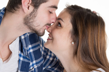 Closeup of a young couple in love and  kissing