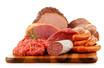 Meat products including ham and sausages isolated on white