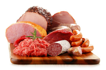 Meat products including ham and sausages isolated on white