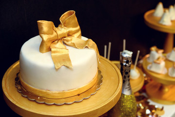 stylish luxury decorated candy bar with frosting cake and champa