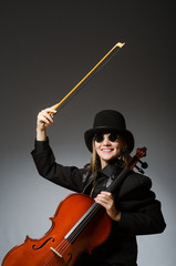 Woman playing classical cello in music concept