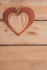 Metal heart on the wooden table
