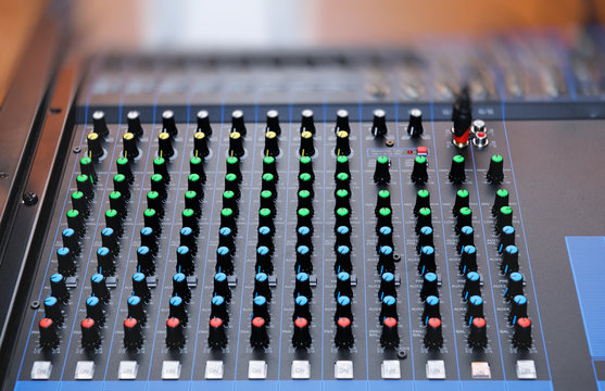 audio mixing console with faders
