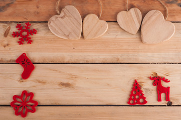 Red Christmas decoration on wooden table