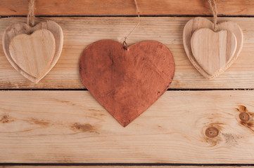 Metal heart on the wooden table