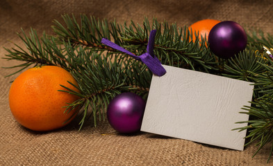 Postcard, orange tangerines, fir-cones, Christmas decorations