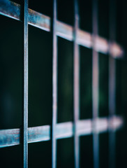 Square vivid prison cell bars closeup deatil bokeh background ba