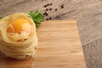 Fettuccini nests with egg