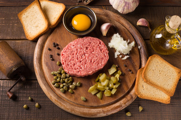 beef tartare on wooden table