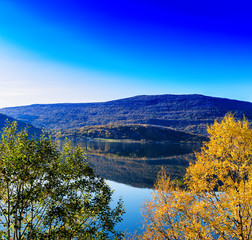 Fototapeta na wymiar Horizontal vivid autumn in Norway background backdrop
